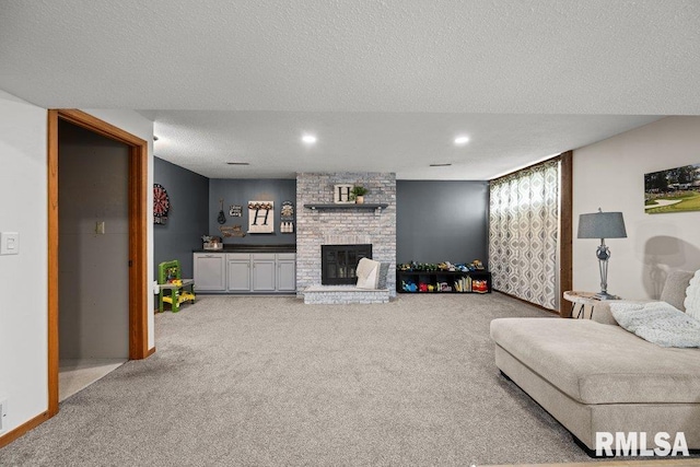 5647 Quercus Ln, Davenport, IA 52806 - carpeted living area with a fireplace, a textured ceiling, and recessed lighting