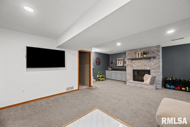 5647 Quercus Ln, Davenport, IA 52806 - living room featuring carpet, a brick fireplace, baseboards, and recessed lighting