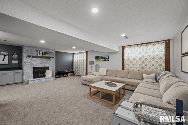 5647 Quercus Ln, Davenport, IA 52806 - living area featuring carpet, a textured ceiling, a fireplace, and recessed lighting