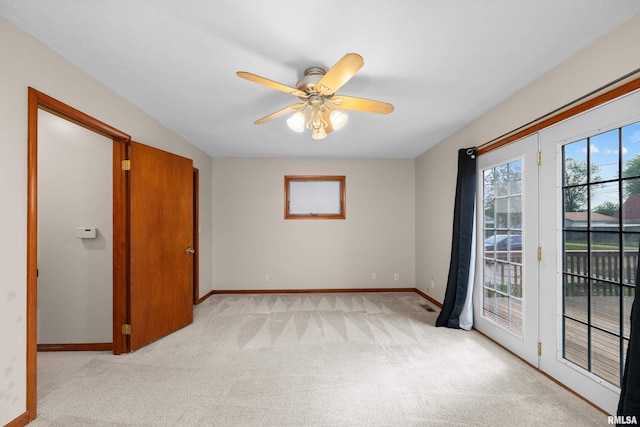 2920 Roosevelt St, Clinton, IA 52732 - empty room featuring light carpet, baseboards, and ceiling fan