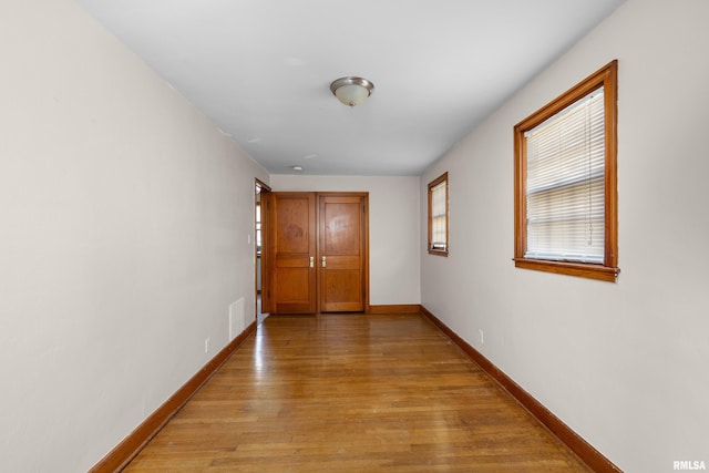 2920 Roosevelt St, Clinton, IA 52732 - hallway with light wood-style floors and baseboards