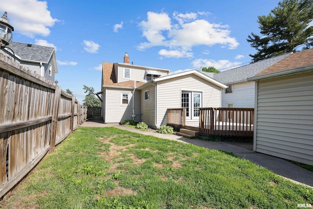 2920 Roosevelt St, Clinton, IA 52732 - back of house with a wooden deck and roof with shingles