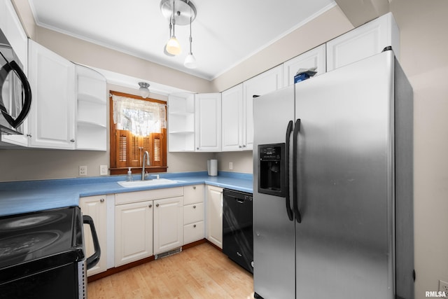 2920 Roosevelt St, Clinton, IA 52732 - kitchen with stainless steel fridge with ice dispenser, open shelves, a sink, dishwasher, and range with electric stovetop
