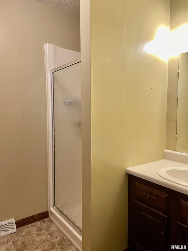 201 S Herrmann Dr, Ridgway, IL 62979 - bathroom with a shower stall, vanity, and baseboards