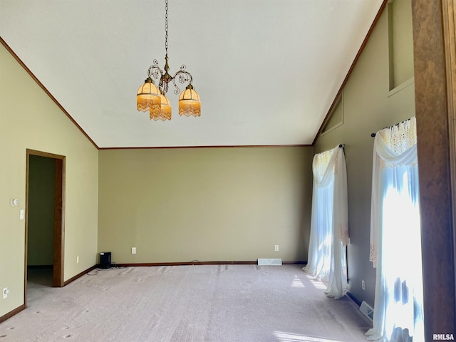 201 S Herrmann Dr, Ridgway, IL 62979 - carpeted spare room featuring lofted ceiling, a chandelier, baseboards, and crown molding