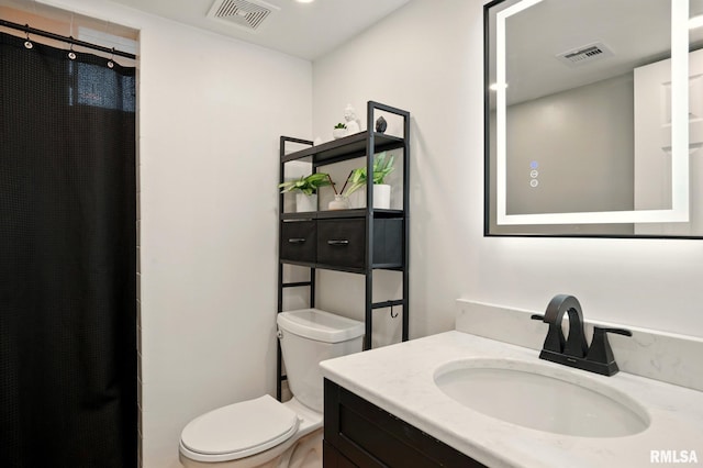 5760 Jenny Ln, Bettendorf, IA 52722 - full bathroom with toilet, vanity, and curtained shower