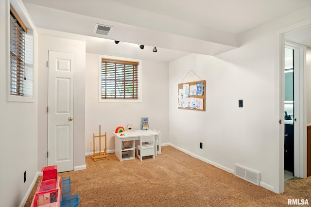 5760 Jenny Ln, Bettendorf, IA 52722 - playroom with light carpet and baseboards