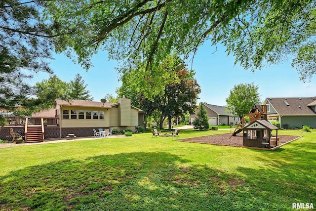 5760 Jenny Ln, Bettendorf, IA 52722 - view of grassy yard featuring a playground, a wooden deck, and stairs
