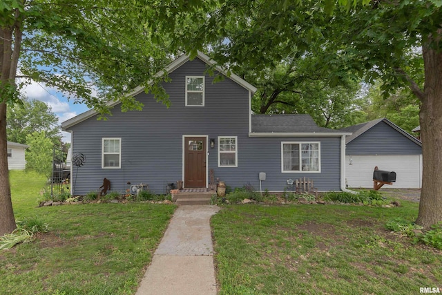 521 E Park St, Geneseo, IL 61254 - traditional home with a front lawn, a garage, and roof with shingles