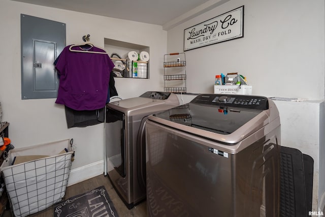 521 E Park St, Geneseo, IL 61254 - washroom featuring electric panel, separate washer and dryer, wood finished floors, and baseboards