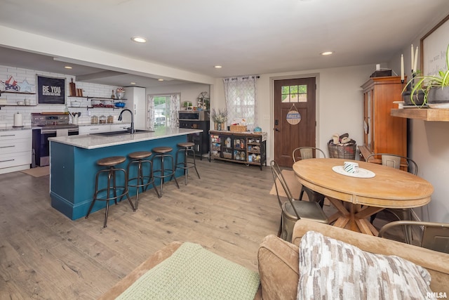 521 E Park St, Geneseo, IL 61254 - dining area featuring healthy amount of natural light, light wood-style flooring, and recessed lighting
