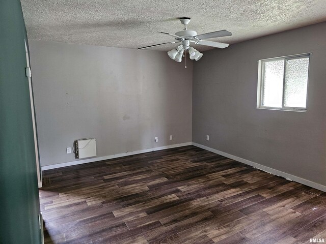 1222 Midway Ct, Marion, IL 62959 - empty room with dark wood-style flooring, ceiling fan, a textured ceiling, and baseboards