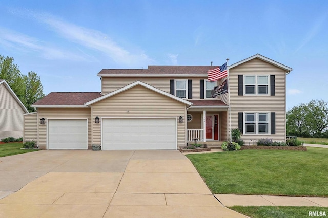 108 N Howard Ln, Long Grove, IA 52756 - traditional home featuring an attached garage, a front lawn, concrete driveway, and covered porch