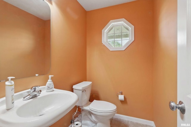 108 N Howard Ln, Long Grove, IA 52756 - half bath featuring a sink, toilet, and tile patterned floors