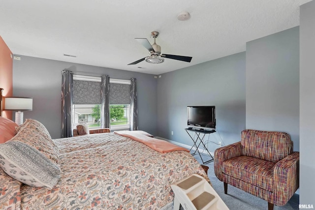 108 N Howard Ln, Long Grove, IA 52756 - carpeted bedroom featuring ceiling fan and baseboards