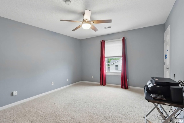 108 N Howard Ln, Long Grove, IA 52756 - office area with a ceiling fan, carpet, baseboards, and a textured ceiling