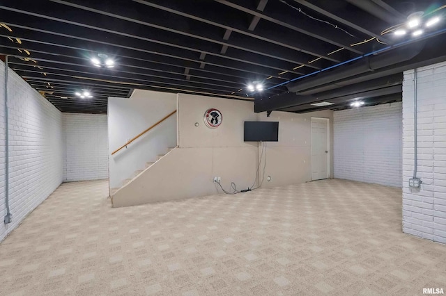 108 N Howard Ln, Long Grove, IA 52756 - finished basement featuring brick wall, stairs, and carpet