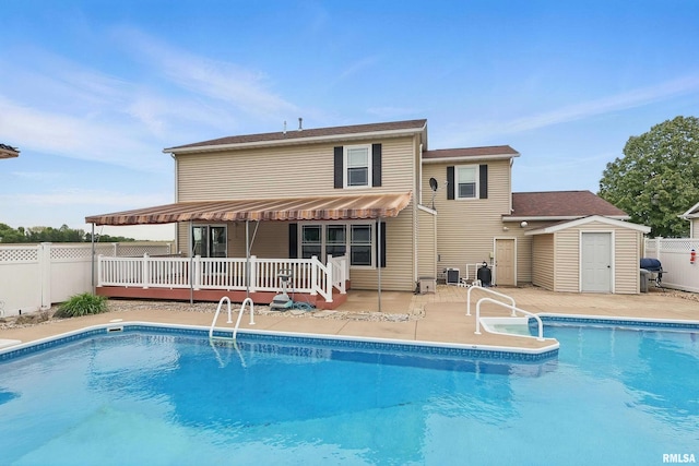108 N Howard Ln, Long Grove, IA 52756 - view of swimming pool featuring a wooden deck, a fenced backyard, area for grilling, central AC, and a patio