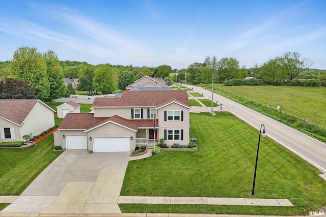108 N Howard Ln, Long Grove, IA 52756 - traditional-style house featuring an attached garage, a front lawn, and concrete driveway