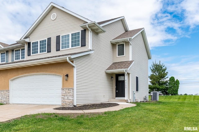 4260 Sapphire Ln, Bettendorf, IA 52722 - view of front facade featuring central air condition unit, a garage, driveway, a front lawn, and stone siding