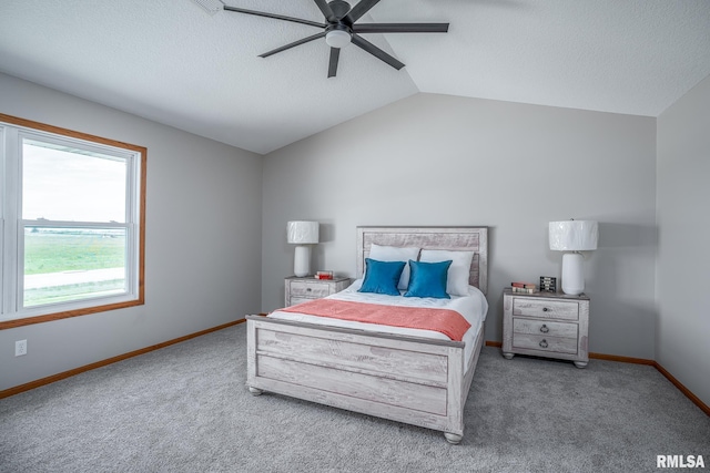 4260 Sapphire Ln, Bettendorf, IA 52722 - carpeted bedroom featuring baseboards, a textured ceiling, lofted ceiling, and ceiling fan