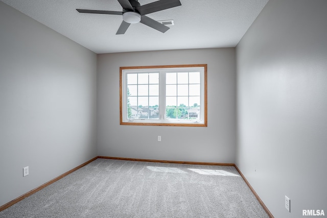 4260 Sapphire Ln, Bettendorf, IA 52722 - spare room with ceiling fan, carpet floors, baseboards, and a textured ceiling