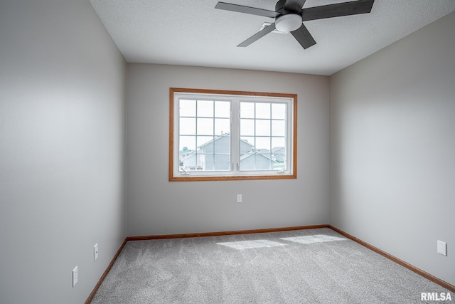 4260 Sapphire Ln, Bettendorf, IA 52722 - carpeted spare room featuring a ceiling fan, baseboards, and a textured ceiling