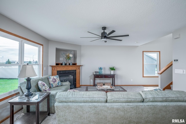 4260 Sapphire Ln, Bettendorf, IA 52722 - living area with carpet flooring, healthy amount of natural light, baseboards, and a textured ceiling