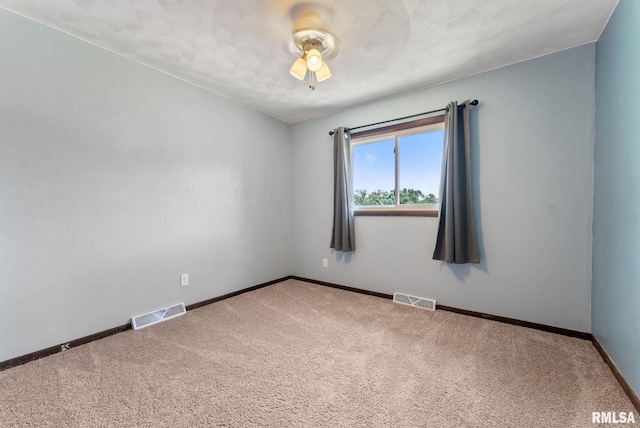 1409 10th Ave, Viola, IL 61486 - carpeted empty room with a ceiling fan and baseboards