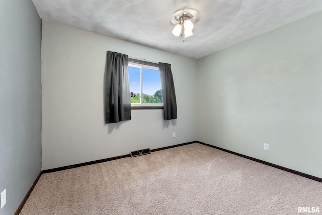 1409 10th Ave, Viola, IL 61486 - carpeted spare room with a ceiling fan and baseboards