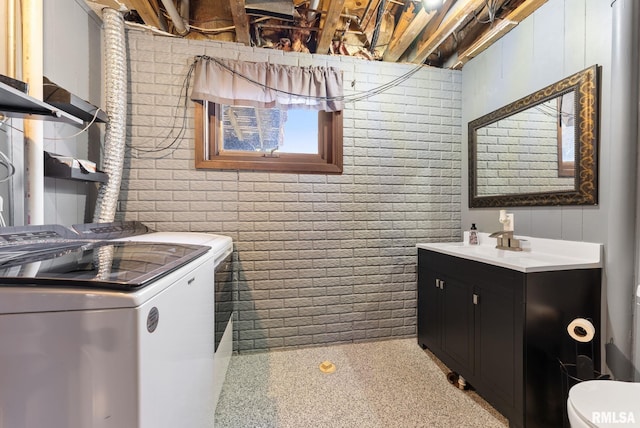 1409 10th Ave, Viola, IL 61486 - laundry room featuring washer and dryer and brick wall