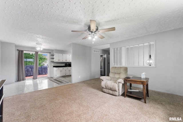 1409 10th Ave, Viola, IL 61486 - living area with ceiling fan and a textured ceiling