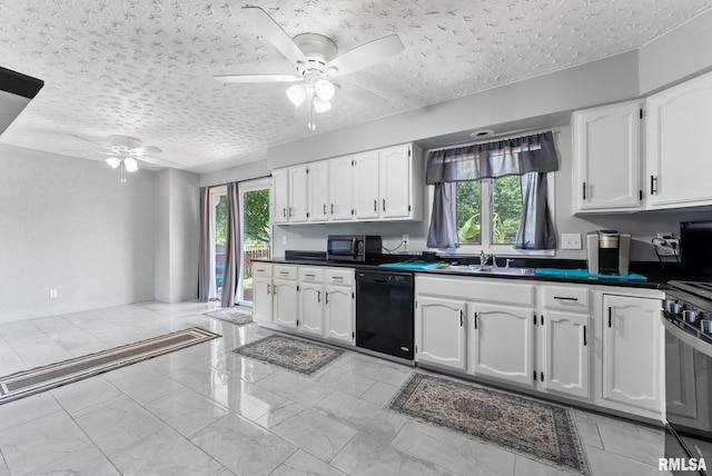 1409 10th Ave, Viola, IL 61486 - kitchen with black dishwasher, ceiling fan, stainless steel microwave, dark countertops, and white cabinetry