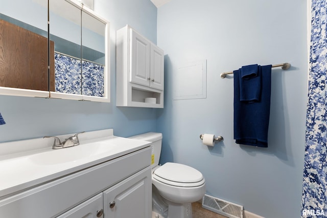 1409 10th Ave, Viola, IL 61486 - full bathroom featuring vanity, toilet, and a shower with shower curtain
