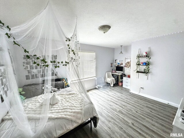 203 Breeze Dr, Carterville, IL 62918 - bedroom featuring baseboards, wood finished floors, and a textured ceiling