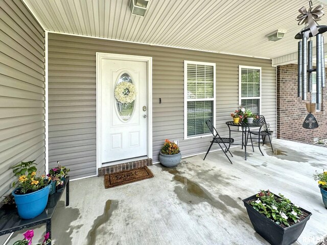 203 Breeze Dr, Carterville, IL 62918 - doorway to property featuring covered porch