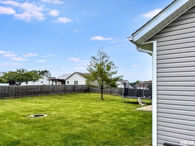 203 Breeze Dr, Carterville, IL 62918 - view of yard with a trampoline