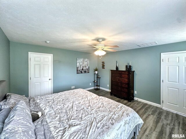 203 Breeze Dr, Carterville, IL 62918 - bedroom with wood finished floors, baseboards, and ceiling fan