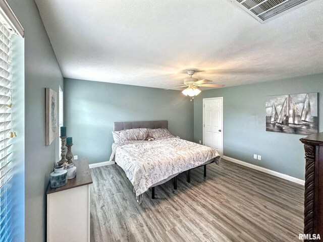 203 Breeze Dr, Carterville, IL 62918 - bedroom featuring wood finished floors, baseboards, and ceiling fan