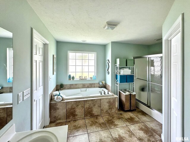 203 Breeze Dr, Carterville, IL 62918 - full bath with a bath, a shower stall, and tile patterned flooring
