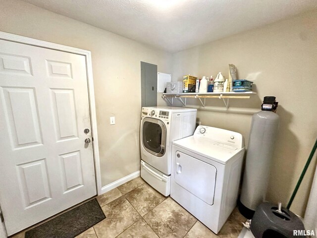 203 Breeze Dr, Carterville, IL 62918 - laundry room with washing machine and dryer, electric panel, and light tile patterned flooring