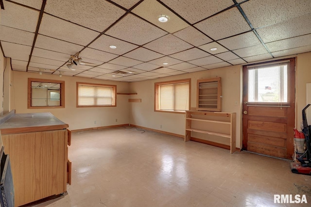 1148 Briarcliff Ln, Clinton, IA 52732 - basement with a paneled ceiling and baseboards