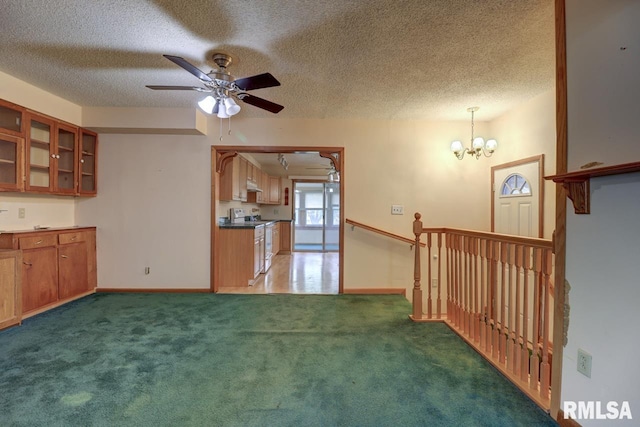 1148 Briarcliff Ln, Clinton, IA 52732 - kitchen with a textured ceiling, ceiling fan, glass insert cabinets, a chandelier, and white range with electric cooktop
