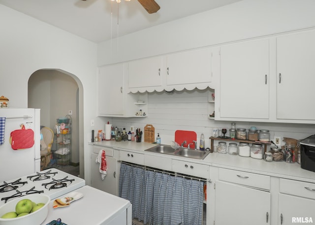1036 30th St, Rock Island, IL 61201 - kitchen featuring a sink, white cabinets, a ceiling fan, and light countertops