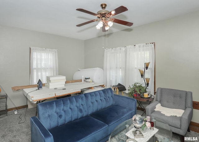 1036 30th St, Rock Island, IL 61201 - carpeted living area with ceiling fan and baseboards