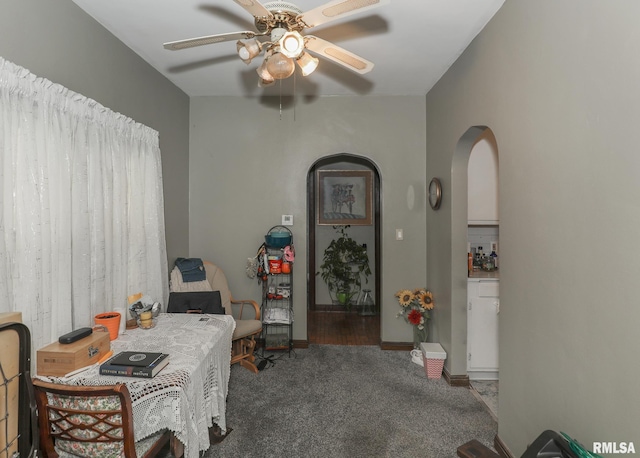 1036 30th St, Rock Island, IL 61201 - carpeted dining area featuring a ceiling fan, arched walkways, and baseboards