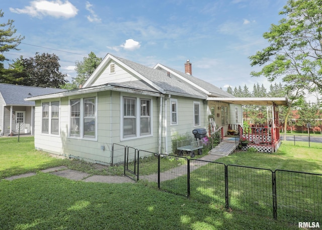 1036 30th St, Rock Island, IL 61201 - rear view of house with roof with shingles and a chimney