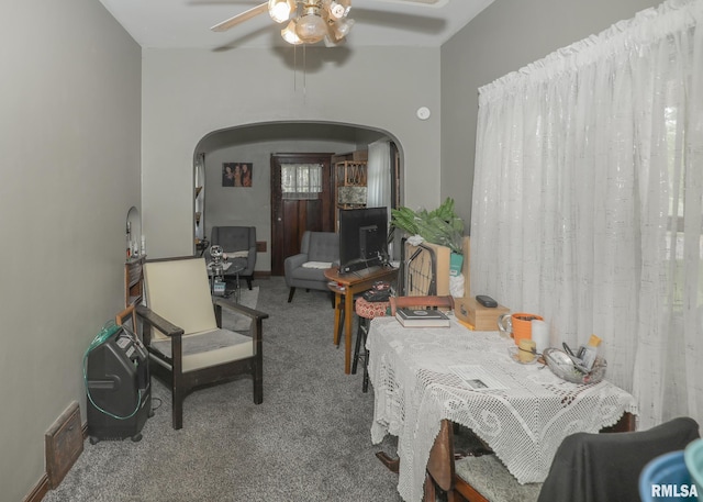 1036 30th St, Rock Island, IL 61201 - dining area featuring arched walkways, carpet, and ceiling fan