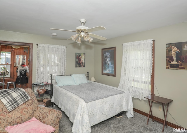 1036 30th St, Rock Island, IL 61201 - carpeted bedroom with baseboards and ceiling fan