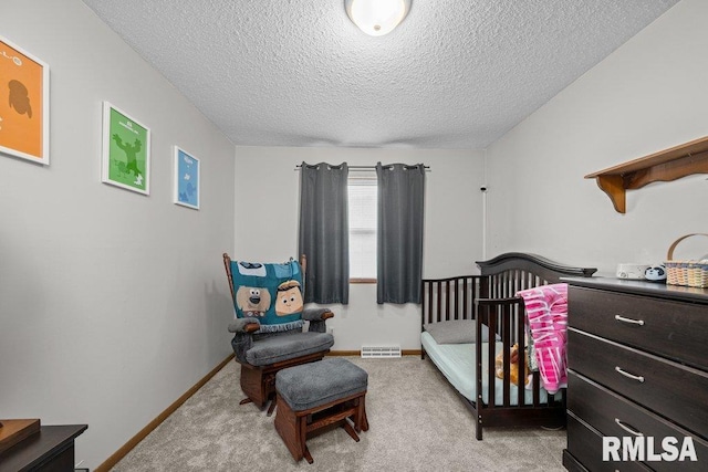 237 Colony Dr, Davenport, IA 52806 - bedroom featuring a textured ceiling, light carpet, and baseboards